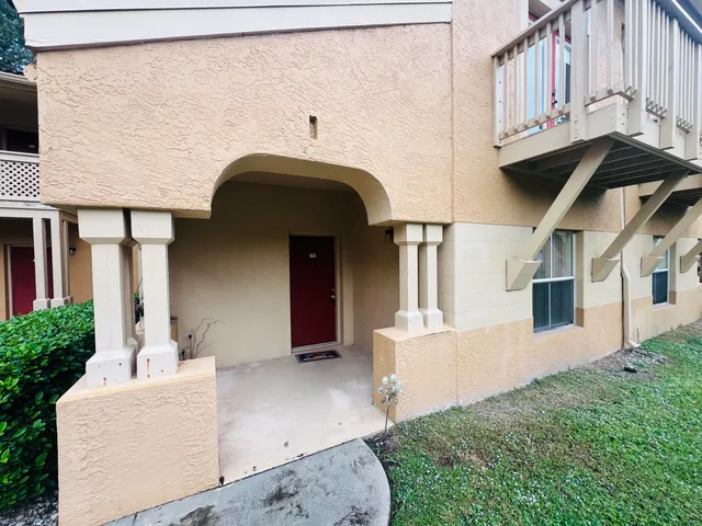 a view of a yard with potted plants