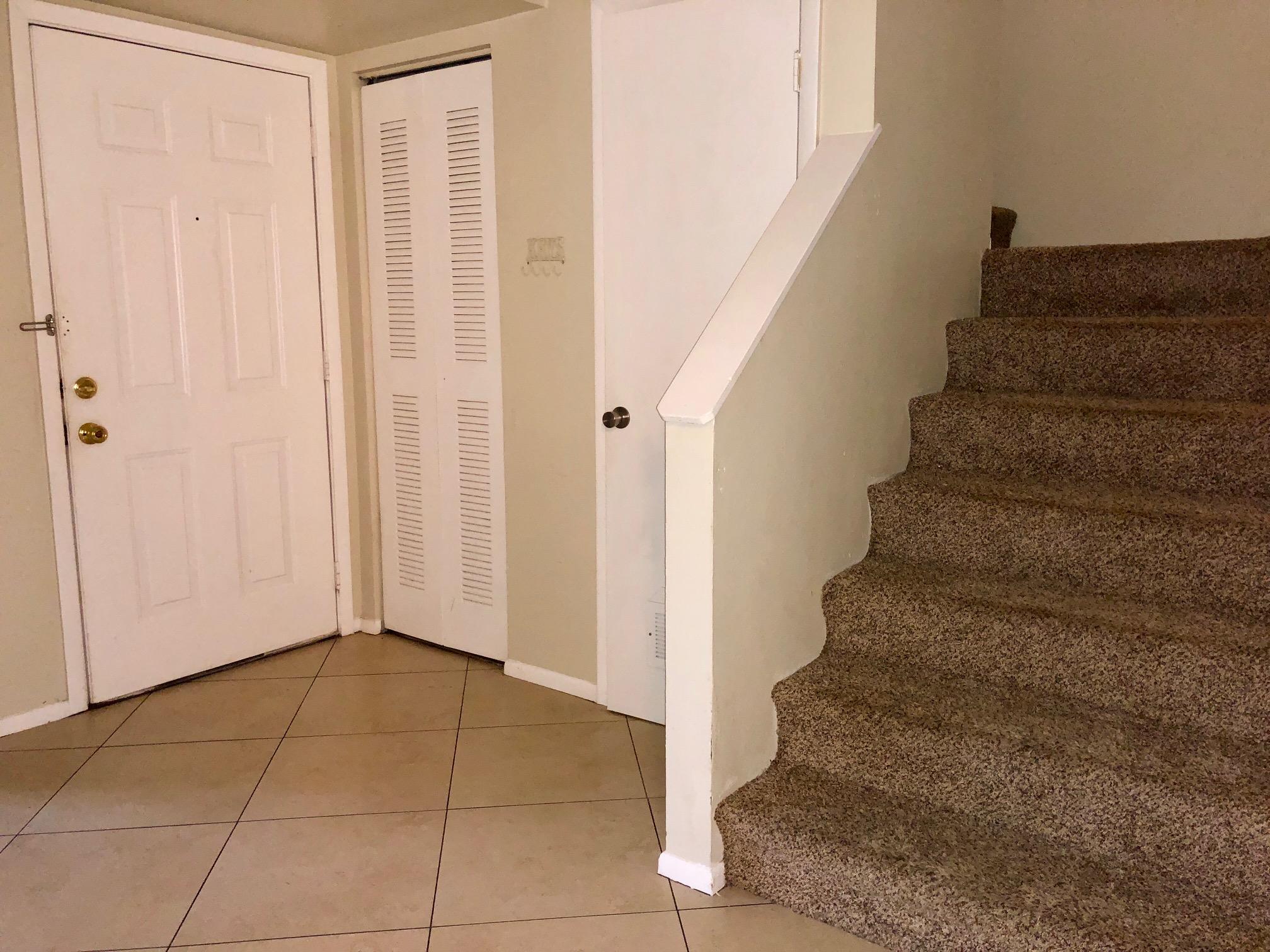 4799 Via Palm Lakes, Unit 1606 West Palm Beach, FL 33417 - Photo 9 of 29 a view of an entryway with staircase