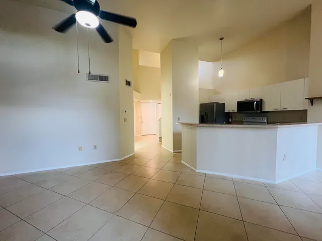 a kitchen with stainless steel appliances granite countertop a sink and cabinets