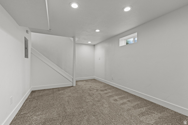 2101 West 3900th Street South Roy, UT 84067 - Photo 24 of 36 Finished lower level featuring recessed lighting, a window, and gray flecked carpeting