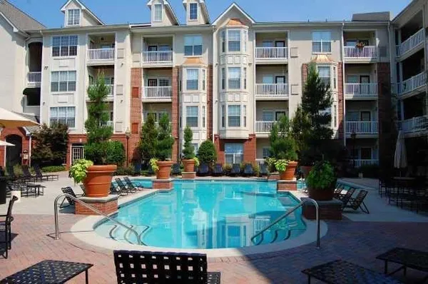 a view of pool with outdoor seating