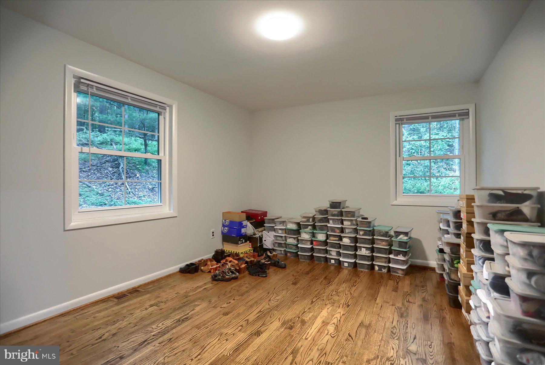 10902 Baronet Road Owings Mills, MD 21117 - Photo 24 of 42 a view of a room with wooden floor and windows