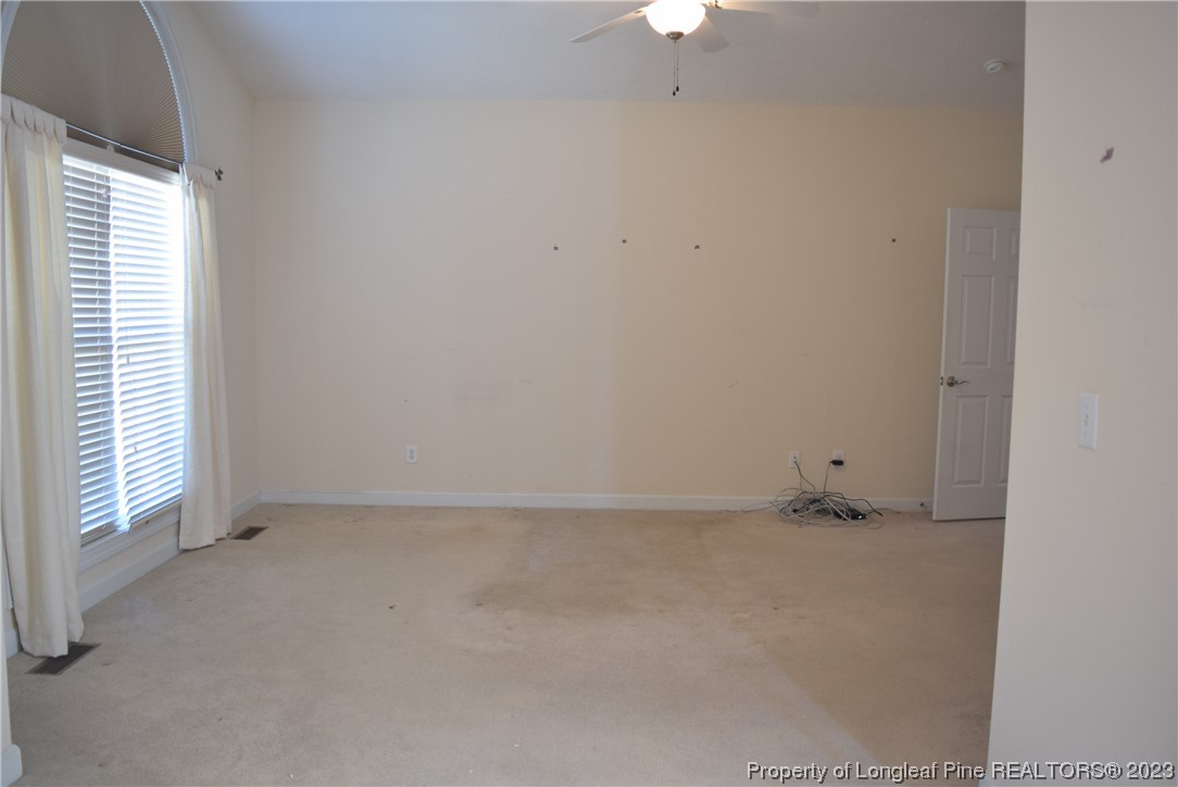 249 Rothbury Drive Whispering Pines, NC 28327 - Photo 15 of 26 an empty room with a window