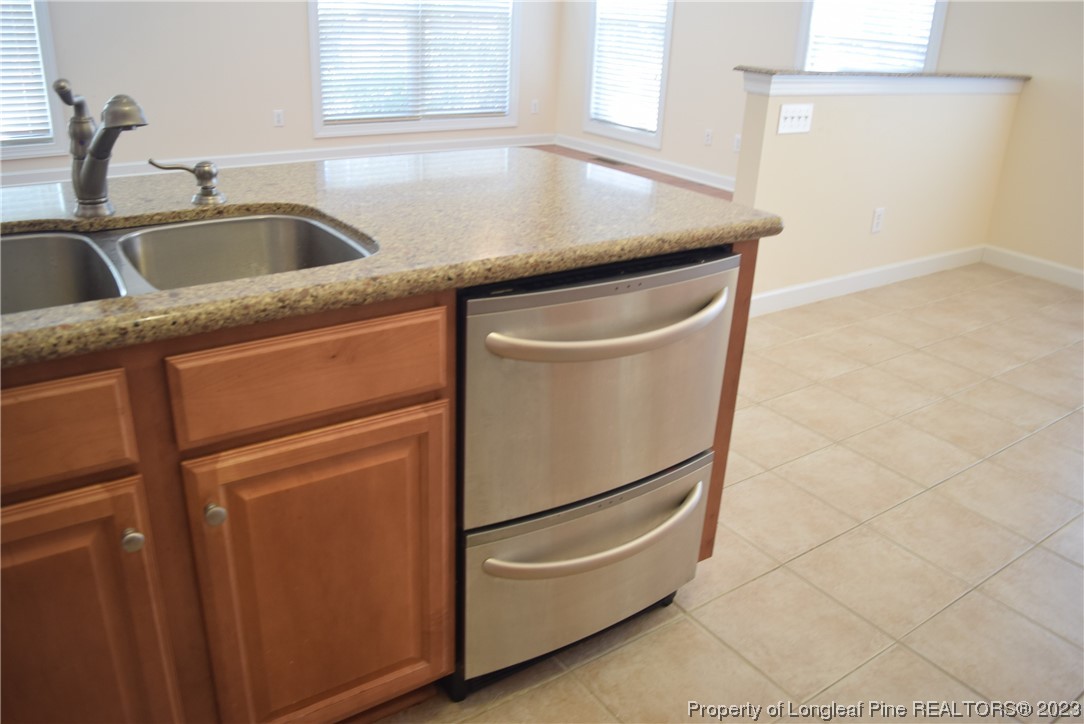 249 Rothbury Drive Whispering Pines, NC 28327 - Photo 7 of 26 a utility room with dryer and washer