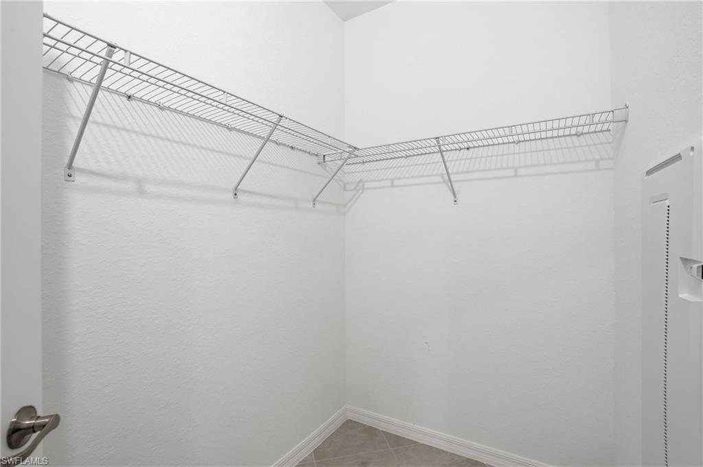 2215 Dragonfruit Way Naples, FL 34120 - Photo 26 of 38 a view of a room with racks on the wall