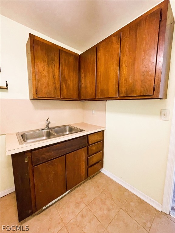 7365 Coon Road North Fort Myers, FL 33917 - Photo 11 of 12 a kitchen with a sink and cabinets