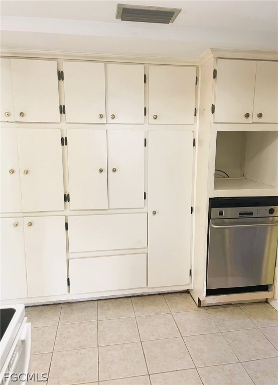 7365 Coon Road North Fort Myers, FL 33917 - Photo 3 of 12 a view of white cabinets and window