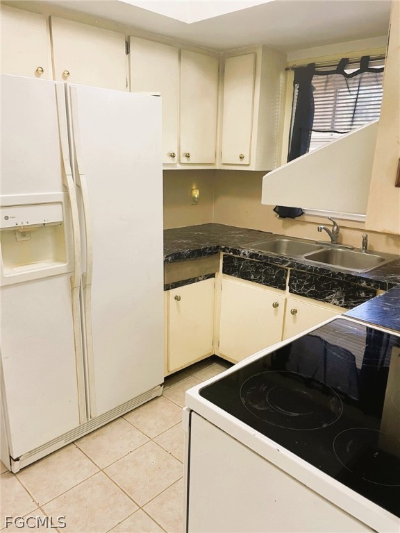7365 Coon Road North Fort Myers, FL 33917 - Photo 4 of 12 a kitchen with a sink and a refrigerator