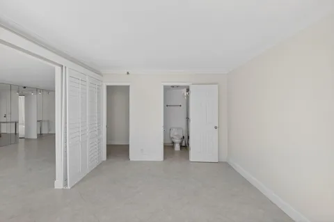 a bathroom that has a toilet and a shower