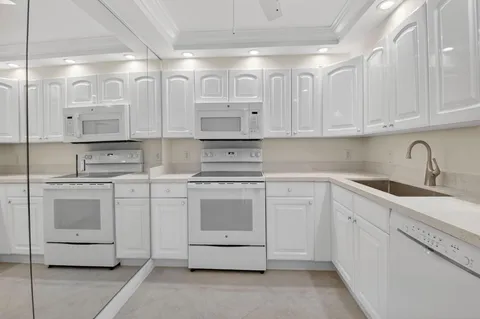 a bathroom with a toilet a sink and shower