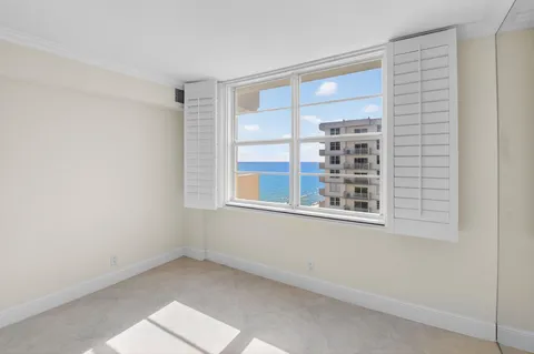 a dining area with furniture and kitchen view