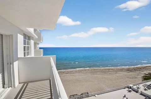 a view of a dining room with furniture and a table