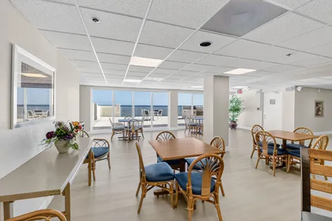 a view of a balcony with an outdoor seating