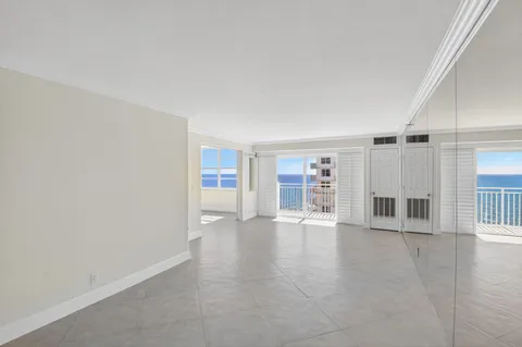 a view of a livingroom with wooden floor and door