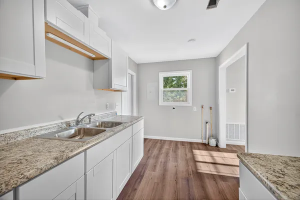 a kitchen with a sink and cabinets