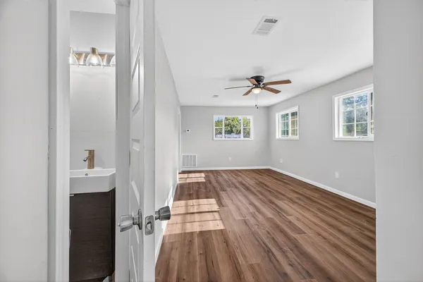a view of front door with wooden floor
