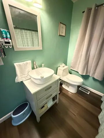 a stove top oven sitting inside of a kitchen