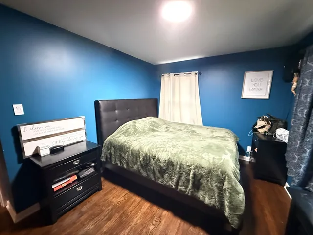 a room with furniture and a wooden floor