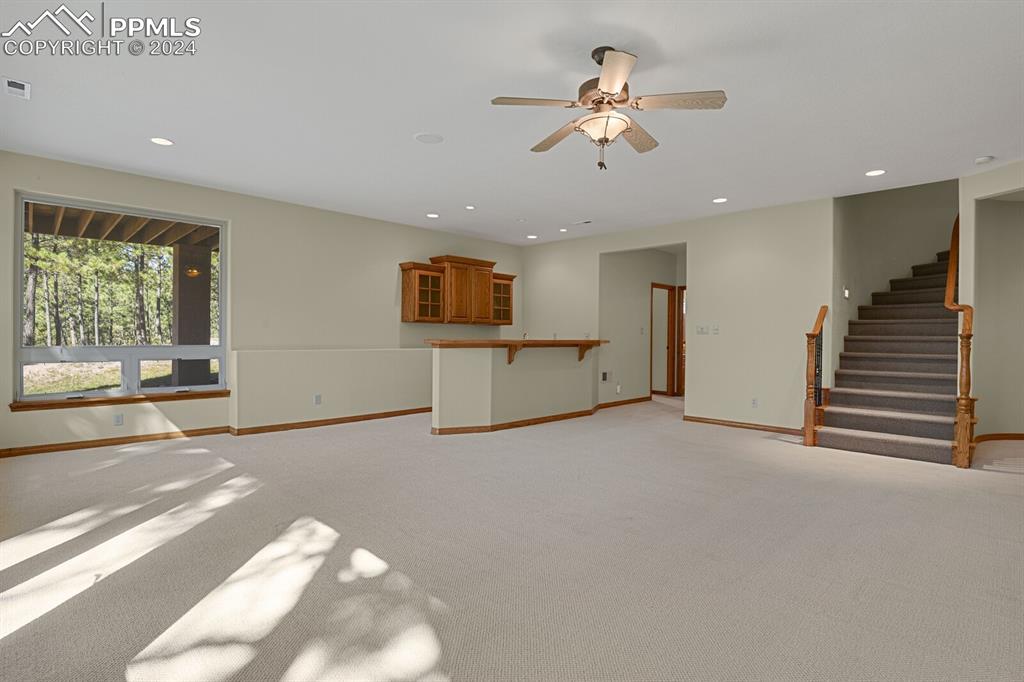 810 Dolan Drive Monument, CO 80132 - Photo 20 of 50 a view of a livingroom with a ceiling fan and window