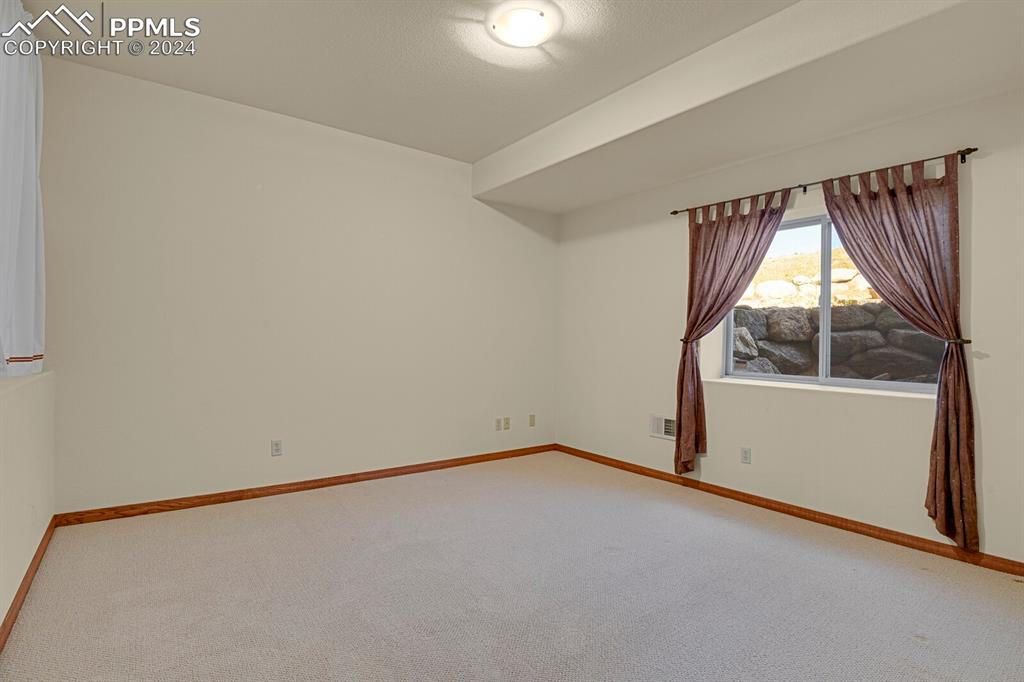 810 Dolan Drive Monument, CO 80132 - Photo 27 of 50 a view of an empty room with a window