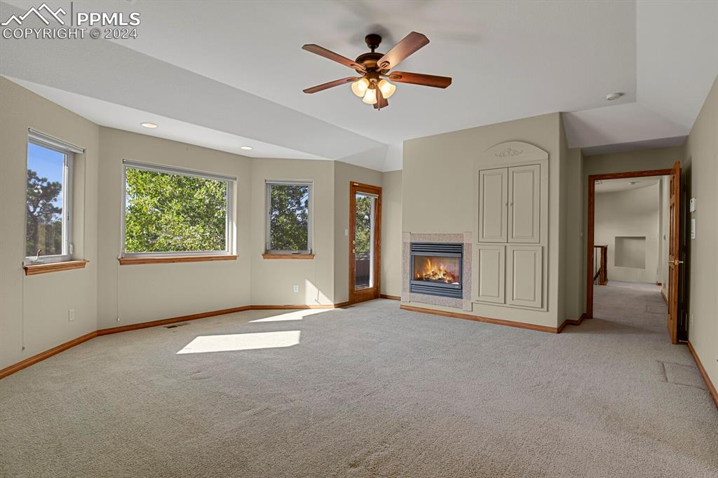 810 Dolan Drive Monument, CO 80132 - Photo 41 of 50 a view of an empty room with window and a kitchen
