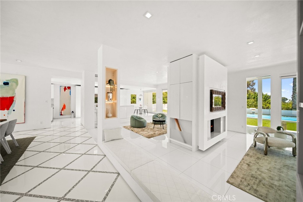 1046 North Hillcrest Road Beverly Hills, CA 90210 - Photo 8 of 74 a living room with furniture and a table