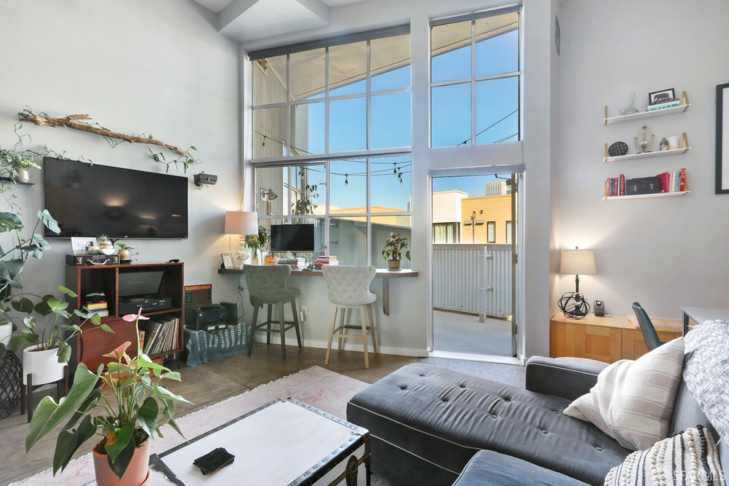 60 Rausch Street, Unit 303 San Francisco, CA 94103 - Photo 17 of 39 a living room with furniture and a flat screen tv