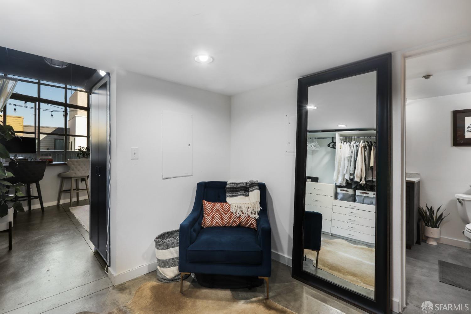 60 Rausch Street, Unit 303 San Francisco, CA 94103 - Photo 22 of 39 a hallway with furniture and a mirror