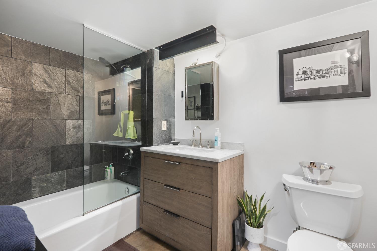 60 Rausch Street, Unit 303 San Francisco, CA 94103 - Photo 24 of 39 a bathroom with a sink a toilet and shower