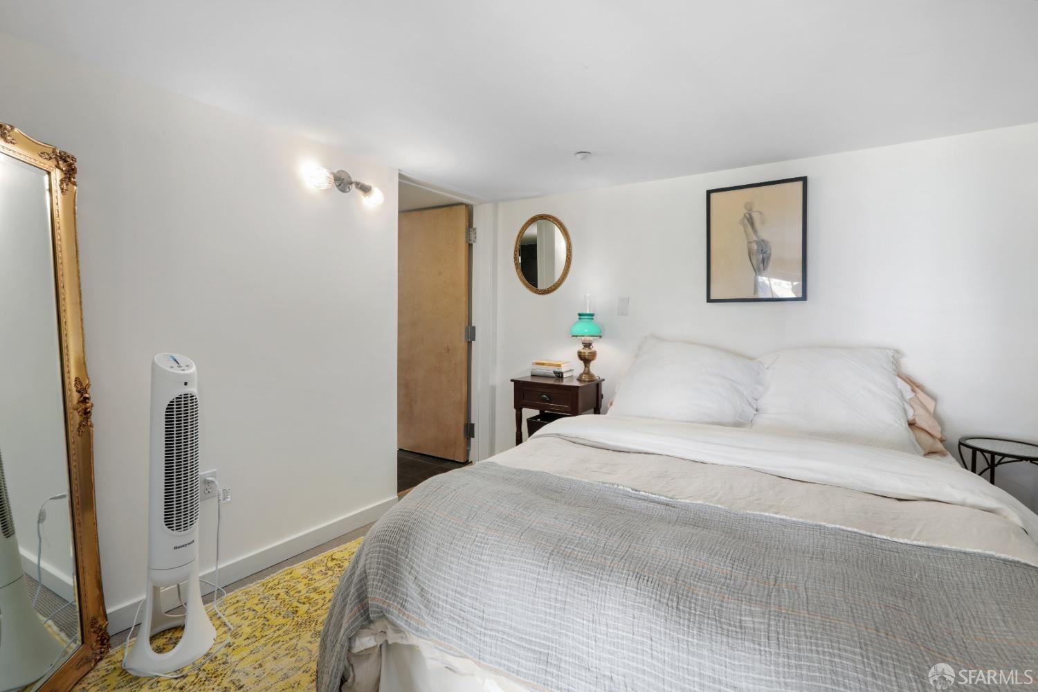 60 Rausch Street, Unit 303 San Francisco, CA 94103 - Photo 27 of 39 a bedroom with a bed and a window