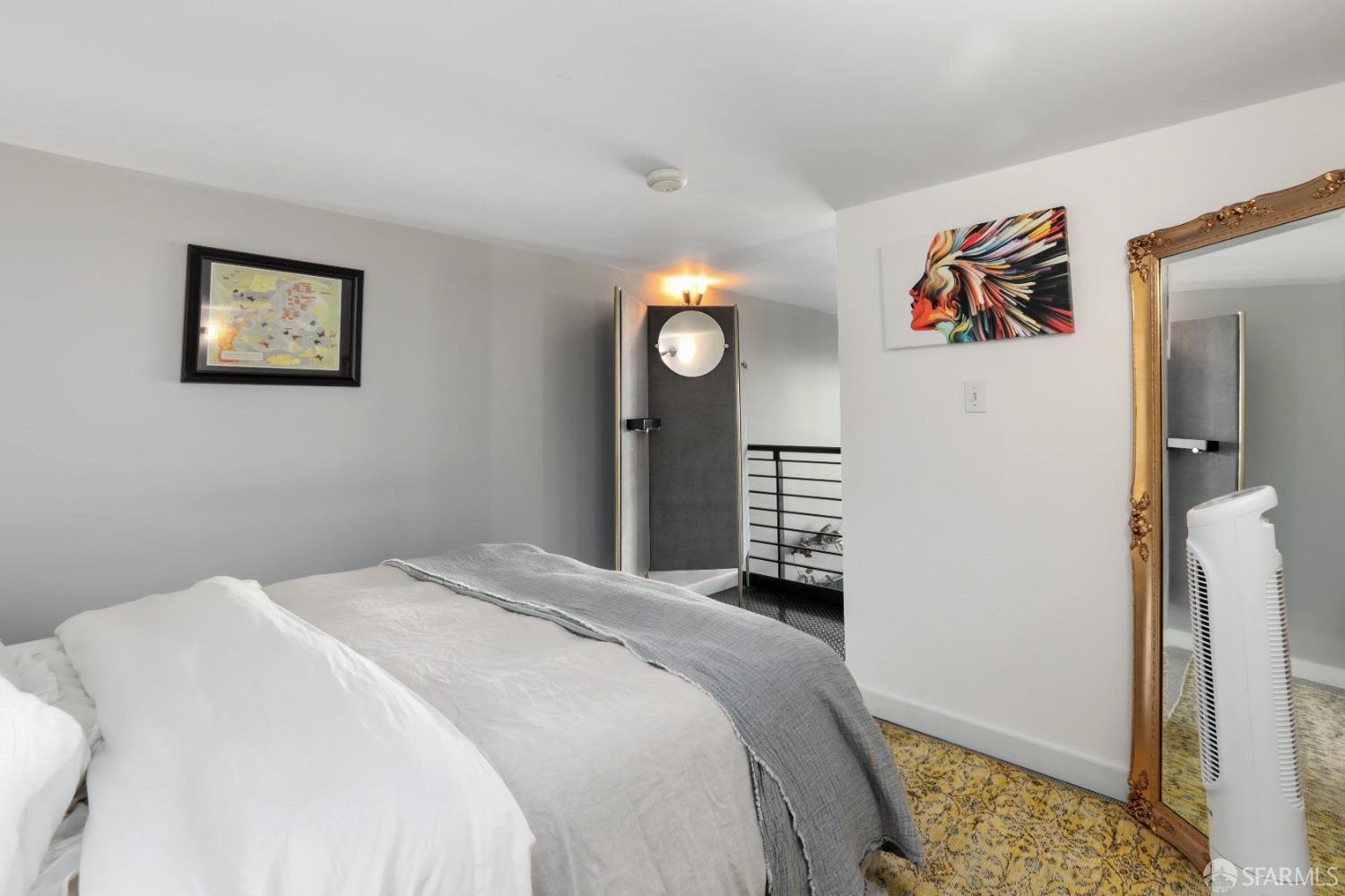 60 Rausch Street, Unit 303 San Francisco, CA 94103 - Photo 29 of 39 a bedroom with a bed and a table