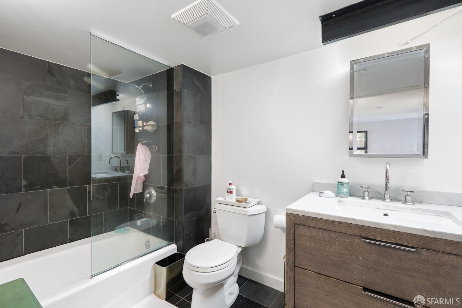 60 Rausch Street, Unit 303 San Francisco, CA 94103 - Photo 30 of 39 a bathroom with a sink a toilet and shower