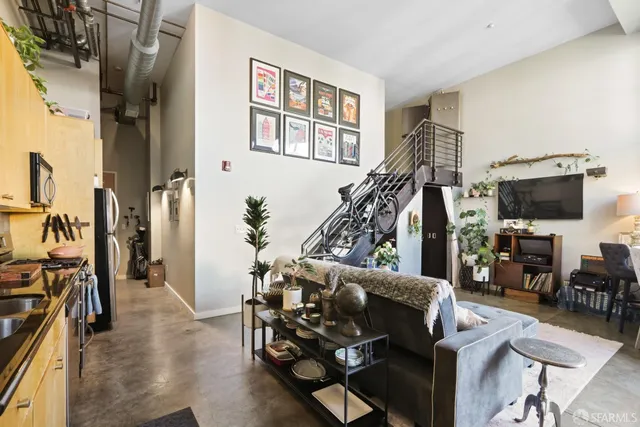 a balcony with furniture and a potted plant