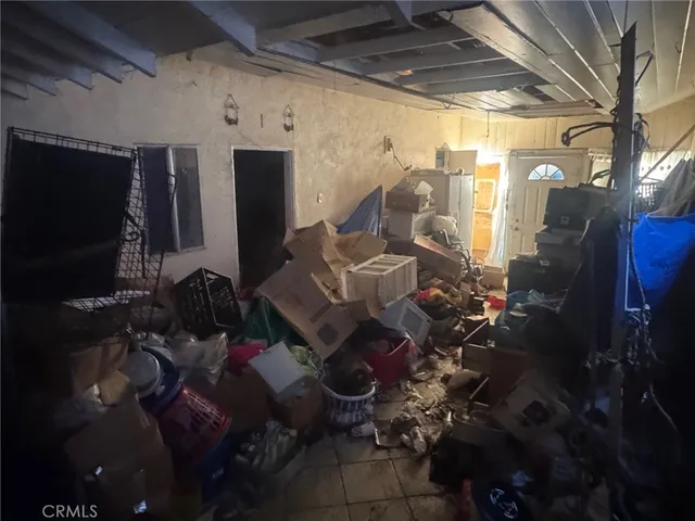 a couple of table and chairs in the room