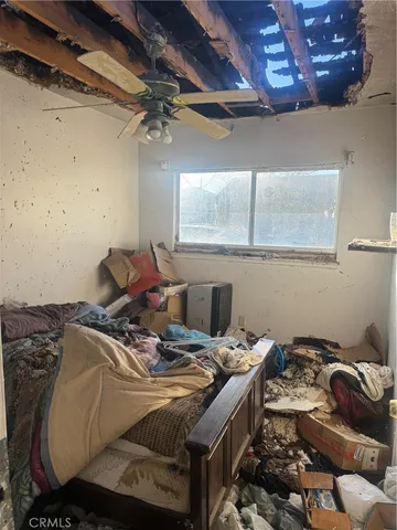 a bed sitting in a room next to a window