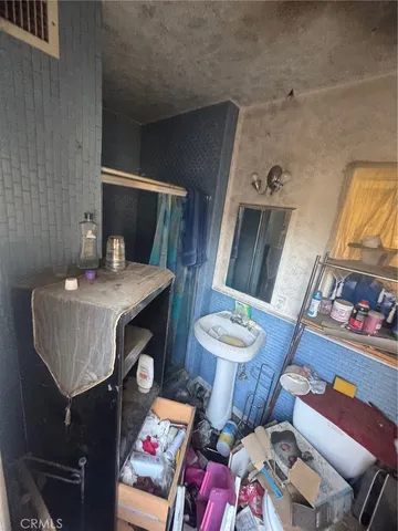 a bathroom with a sink mirror and toilet