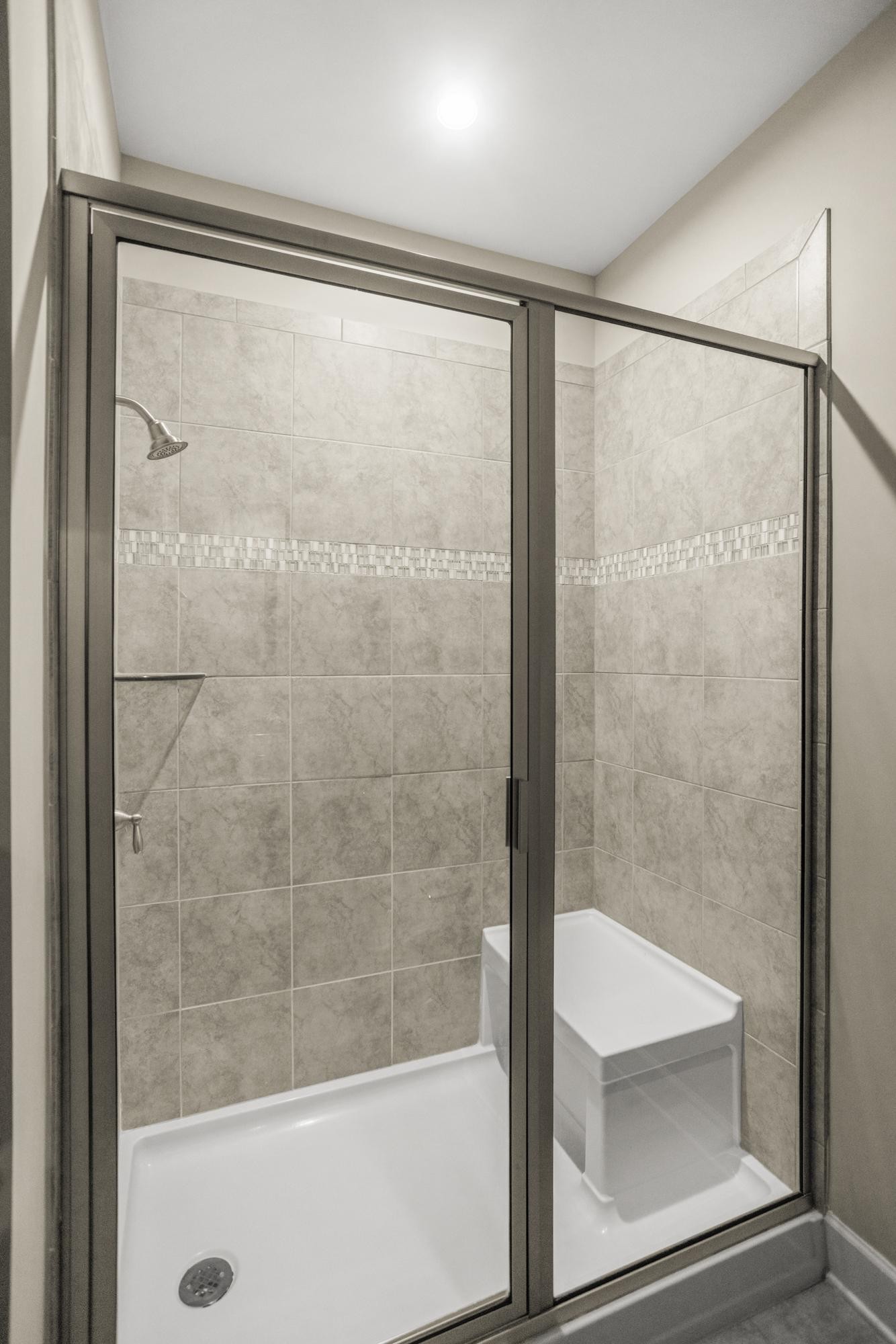 141 Saundersville Road, Unit 1402 Hendersonville, TN 37075 - Photo 19 of 60 a bathroom with a glass shower door