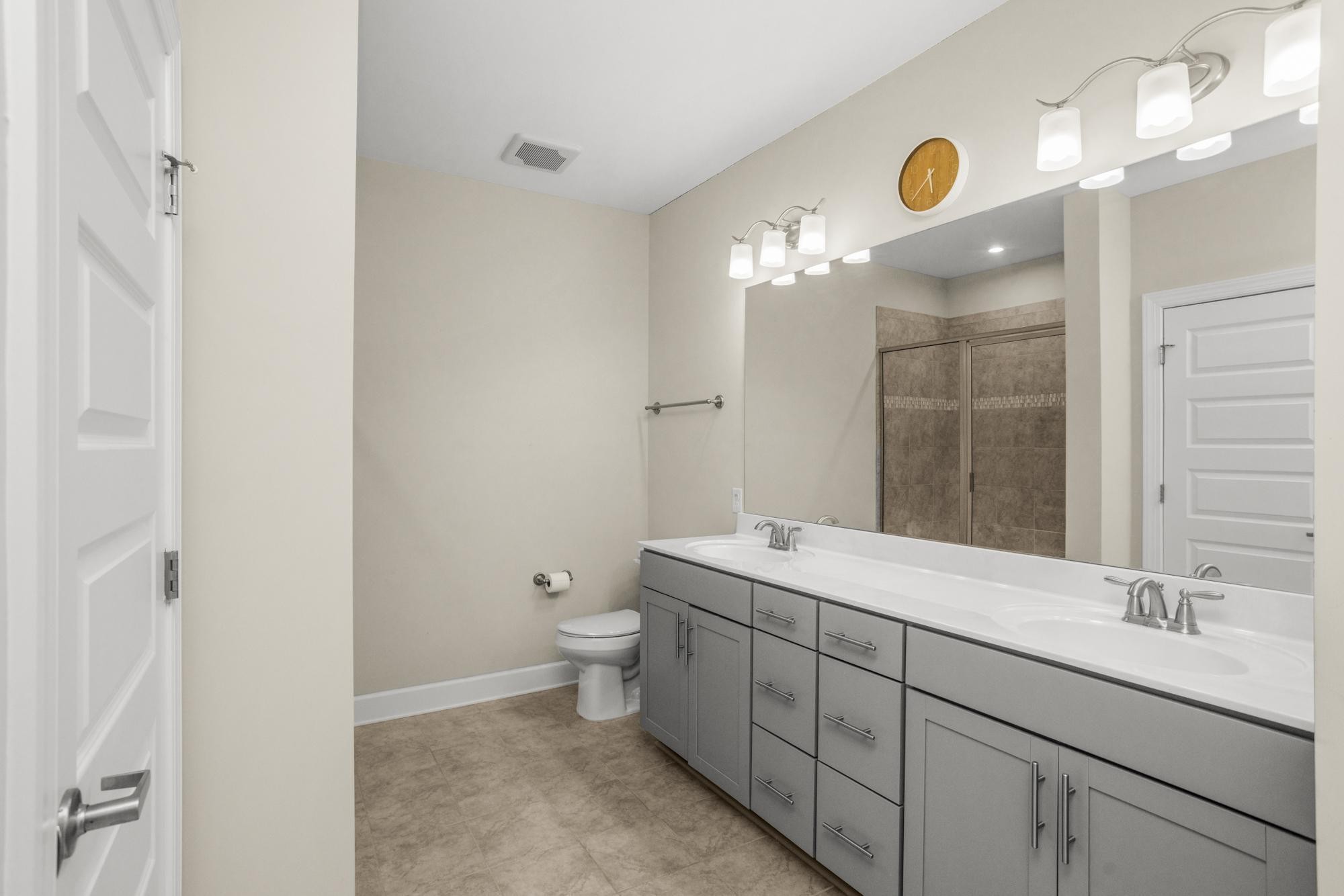 141 Saundersville Road, Unit 1402 Hendersonville, TN 37075 - Photo 20 of 60 a bathroom with a granite countertop sink and a mirror