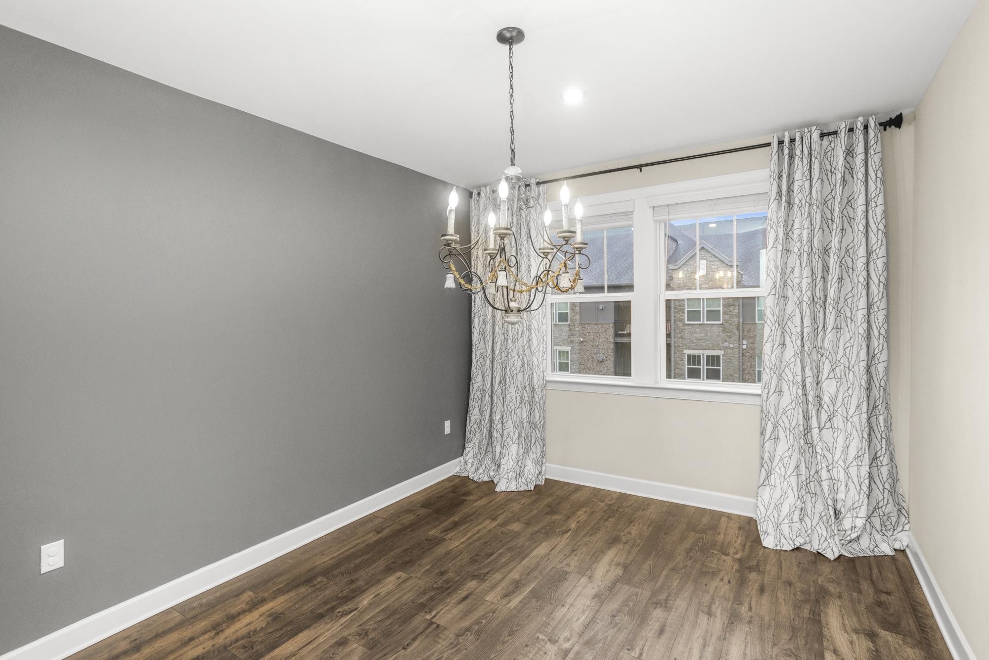 141 Saundersville Road, Unit 1402 Hendersonville, TN 37075 - Photo 33 of 60 a view of a room with wooden floor chandelier and windows