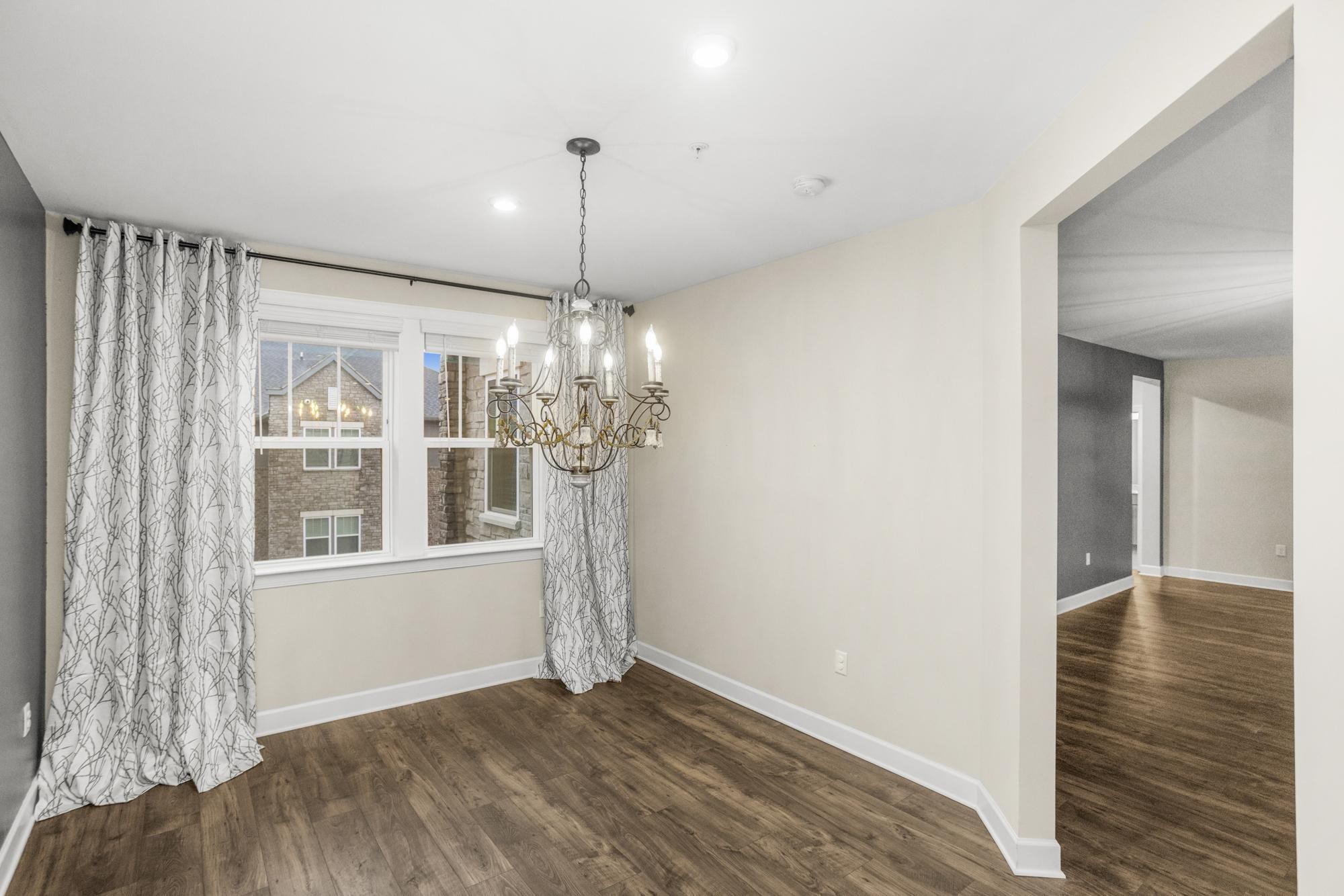 141 Saundersville Road, Unit 1402 Hendersonville, TN 37075 - Photo 34 of 60 a view of an empty room with wooden floor and a window