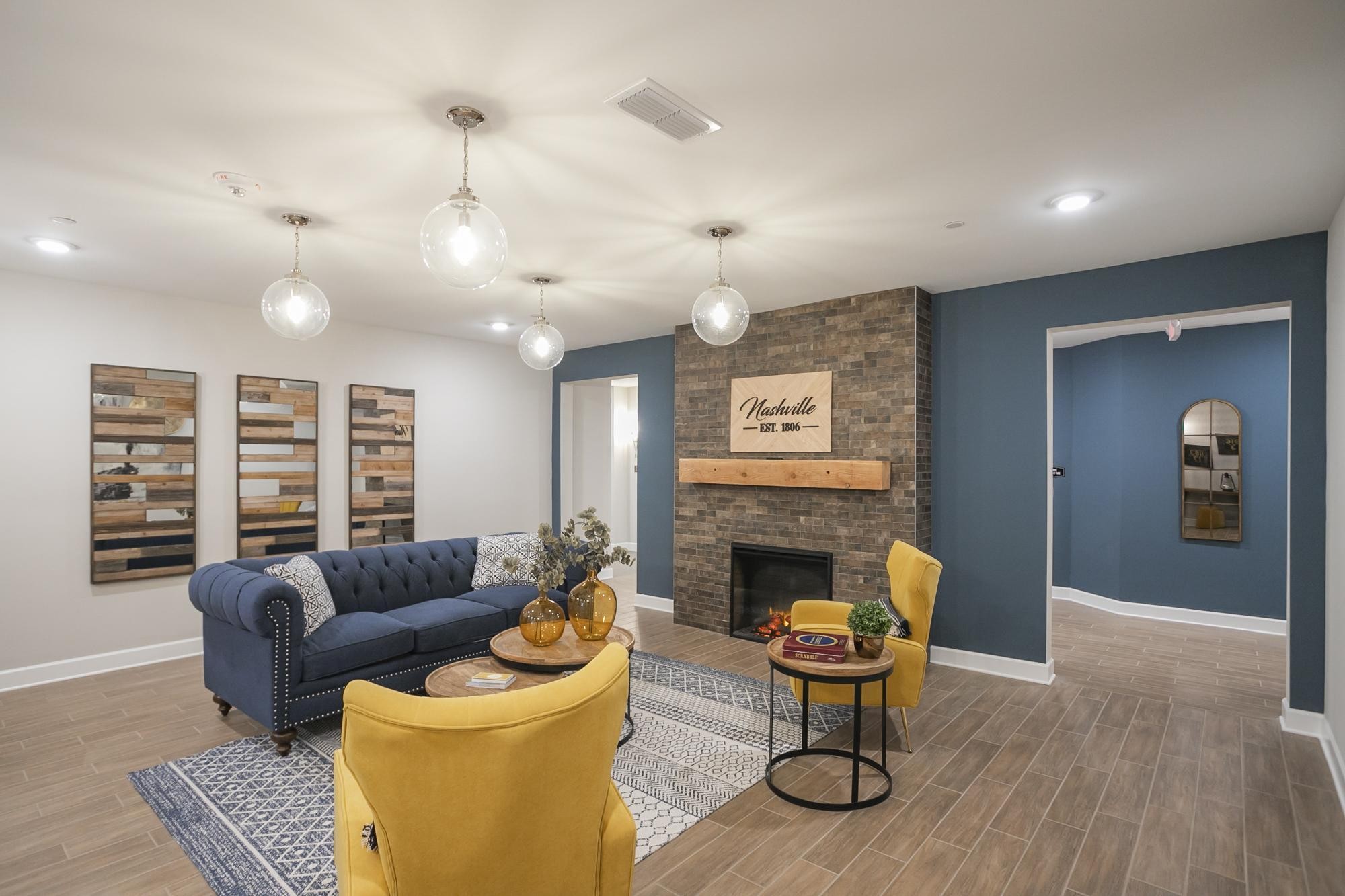 141 Saundersville Road, Unit 1402 Hendersonville, TN 37075 - Photo 42 of 60 a living room with furniture a fireplace and a flat screen tv