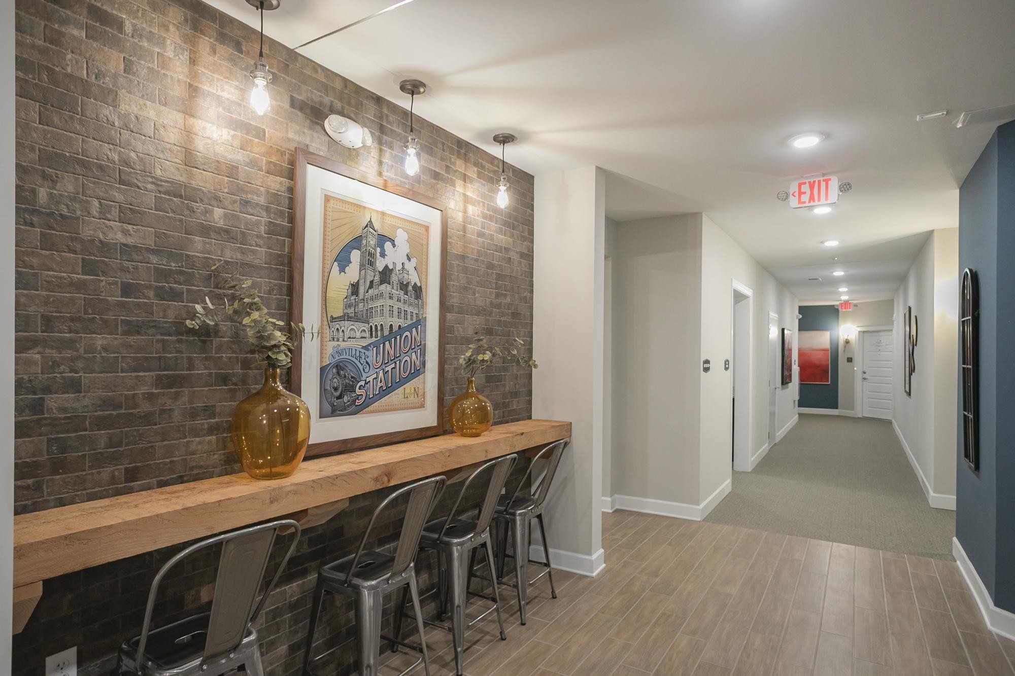141 Saundersville Road, Unit 1402 Hendersonville, TN 37075 - Photo 50 of 60 a hallway with dining area and chandelier
