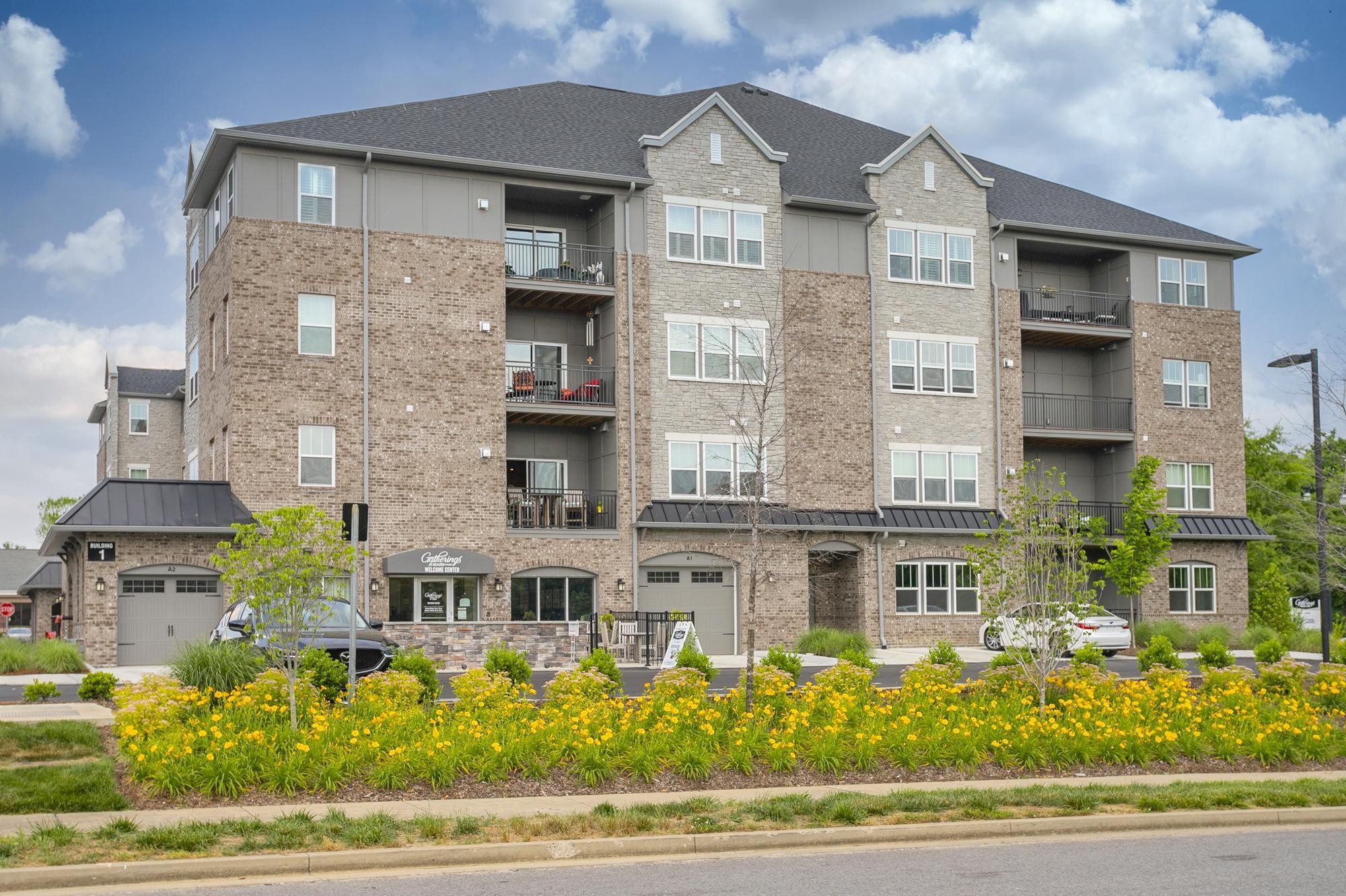141 Saundersville Road, Unit 1402 Hendersonville, TN 37075 - Photo 59 of 60 a front view of a multi story residential apartment building with yard