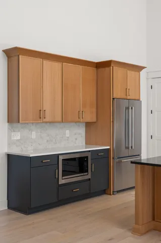a kitchen with granite countertop a stove and a sink