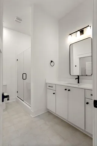 a bathroom with a sink and mirror
