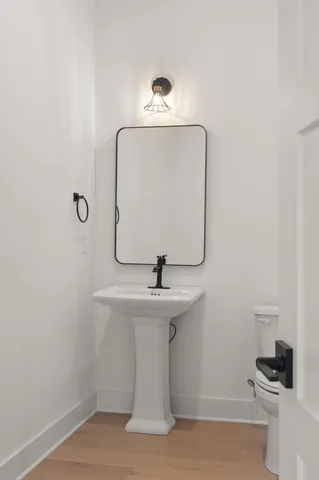 a view of cabinets a window and a wooden floor
