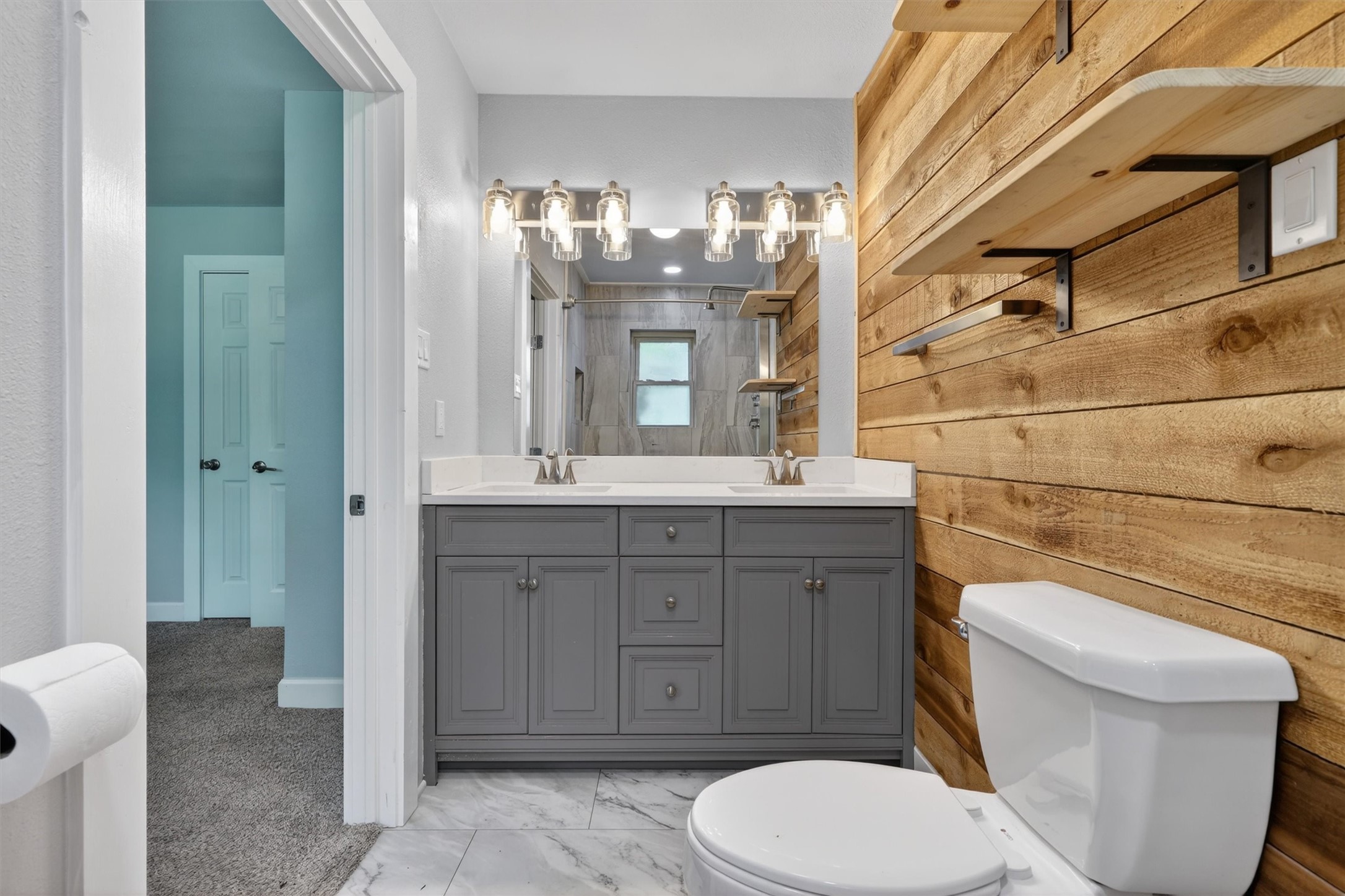 379 Hale Road Bay City, TX 77414 - Photo 19 of 28 a bathroom with a toilet a sink and mirror