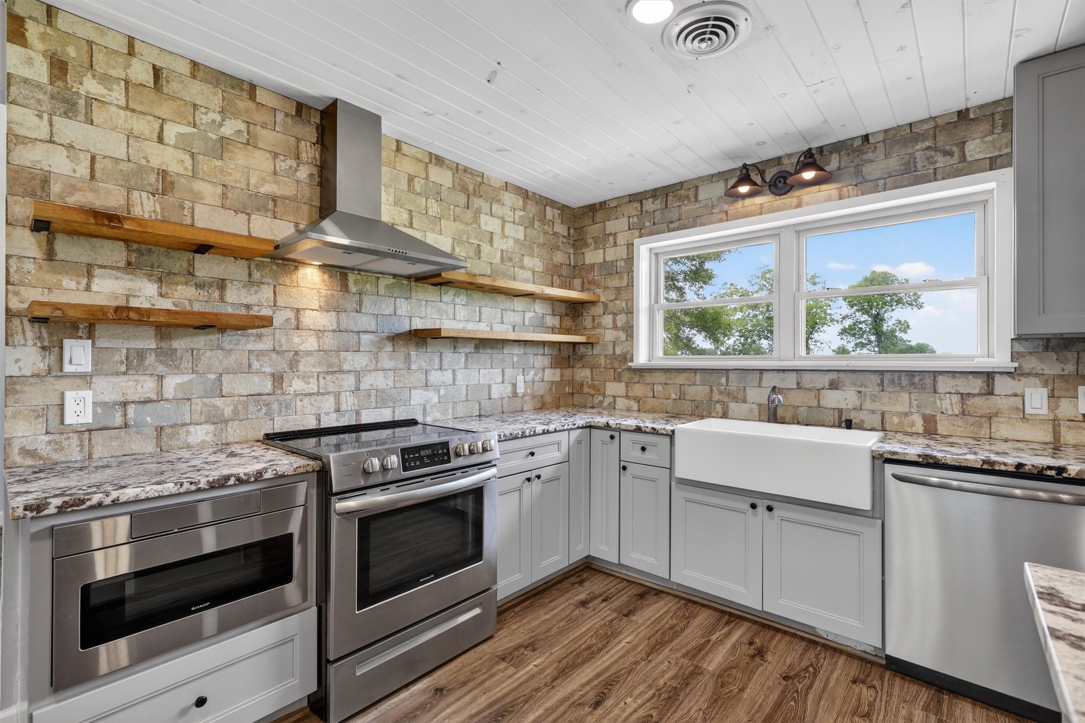 379 Hale Road Bay City, TX 77414 - Photo 6 of 28 a kitchen with a stove and a sink