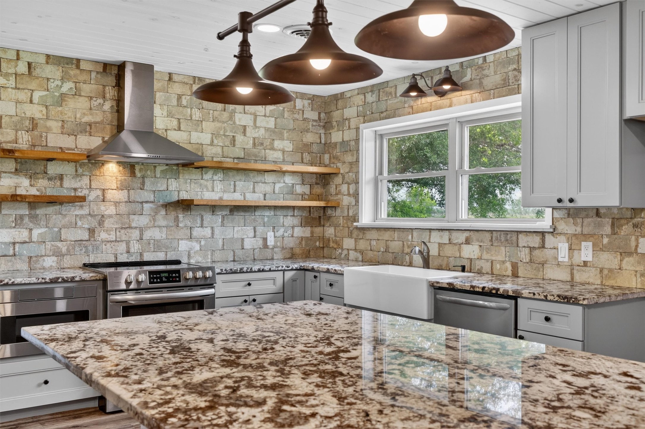 379 Hale Road Bay City, TX 77414 - Photo 7 of 28 a kitchen with a stove and a sink