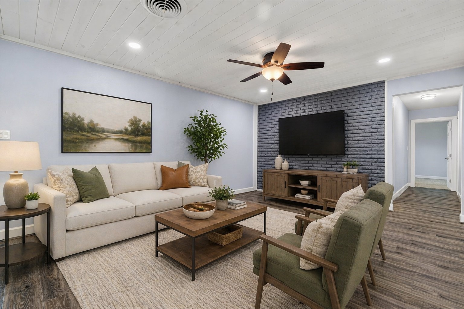 379 Hale Road Bay City, TX 77414 - Photo 9 of 28 a living room with furniture and a flat screen tv
